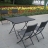Set salon de jardin pliable compose d une table rectangulaire avec plateau en resine tressee et 4 chaises.