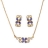 Parure plaqué or collier et boucles d'oreille zirconias bleus et